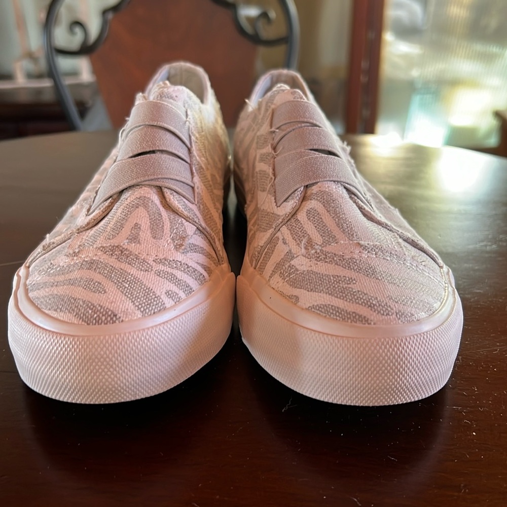 Zebra print slip on shoes